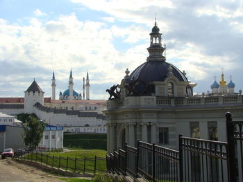View of buildings in city against sky