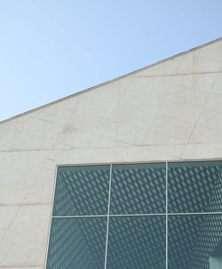 Low angle view of building against clear blue sky