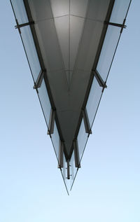 Low angle view of cables against blue sky