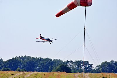 Low angle view of airplane flying in sky