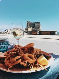 Close-up of food on table against sky