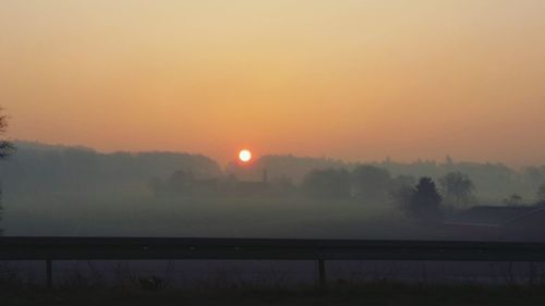 Scenic view of landscape at sunset