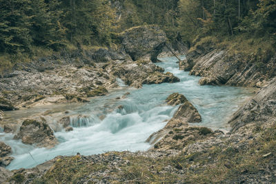 Scenic view of water flowing through rocks