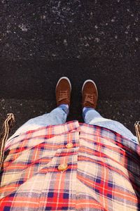 Low section of man standing on floor