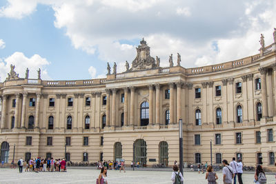 Group of people in front of historical building