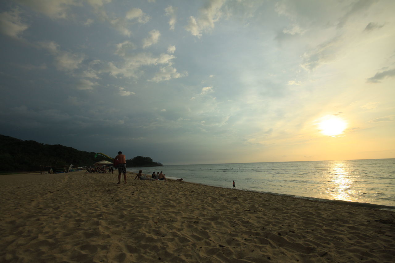 PEOPLE AT BEACH DURING SUNSET