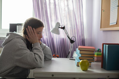 Student heartbroken at how many more books she will have to read.