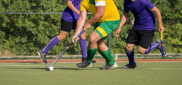 Low section of sportsperson playing hockey