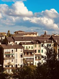 Houses in city against sky