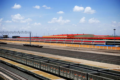 Train at railroad station against sky