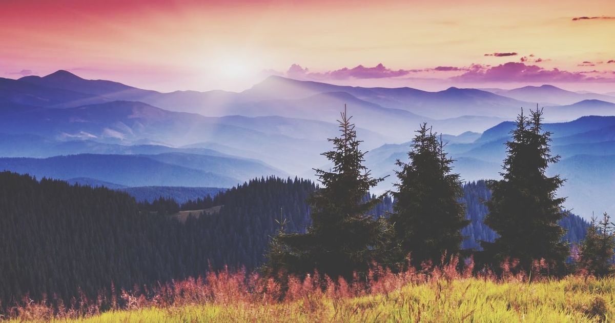 SCENIC VIEW OF MOUNTAINS DURING SUNSET