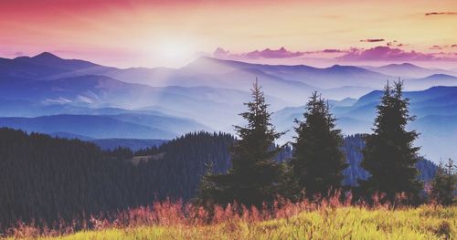 Scenic view of mountains against sky during sunset