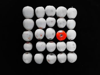 High angle view of candies against black background