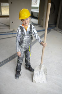 Rear view of man working at construction site