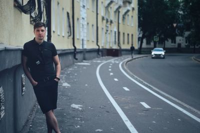 Portrait of young woman walking on street