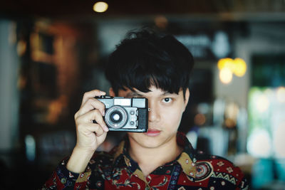 Portrait of man photographing