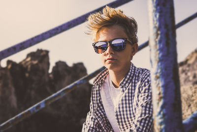 Portrait of young man wearing sunglasses