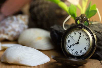 Close-up of clock on table