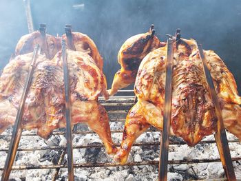 High angle view of meat on barbecue grill