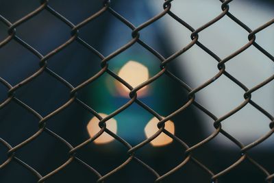 Full frame shot of chainlink fence against clear sky