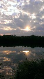 Scenic view of lake at sunset