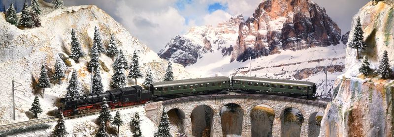 Panoramic view of snow covered mountain against sky