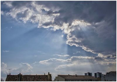 Low angle view of cityscape against sky