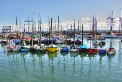 Boats moored at harbor