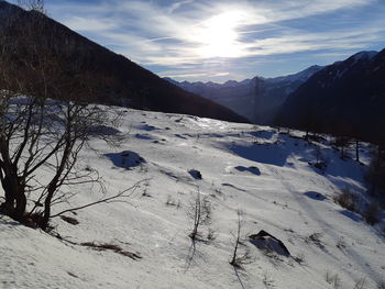Scenic view of snow covered mountains against sky