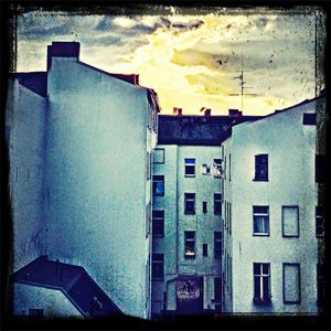 Buildings against sky at sunset