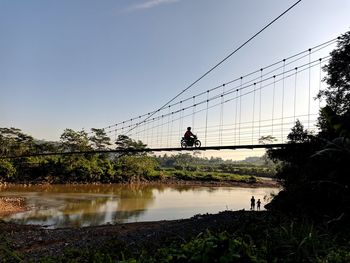 Bridge over river against sky