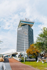 Low angle view of building against cloudy sky