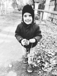 Portrait of smiling boy standing in winter