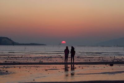 Scenic view of sea at sunset