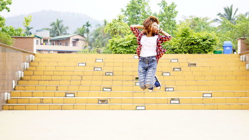 Young woman jumping outdoors