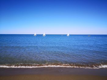 Scenic view of sea against clear sky