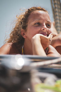 Portrait of a young woman sitting outdoors