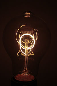 Close-up of illuminated light bulb