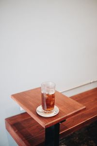 Glass of drink on table