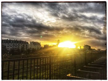 Scenic view of buildings against sky during sunset