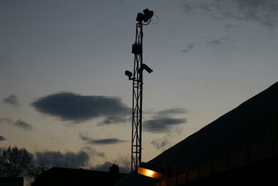 Low angle view of street light against sky