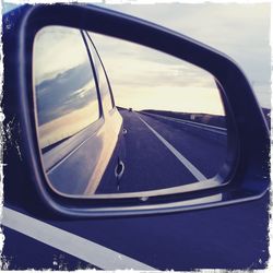 Cropped image of car on road