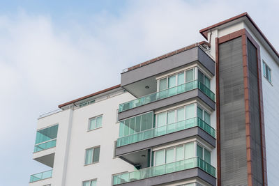 Residential building with balconies on a cloudy day in alanya, turkey. 