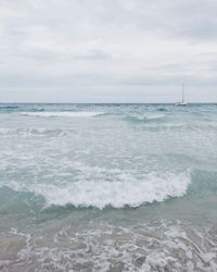 Scenic view of sea against cloudy sky