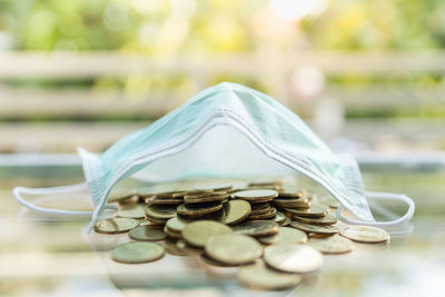 Close-up of coins on table