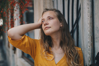 Portrait of young woman looking away