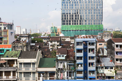 Buildings in city against sky