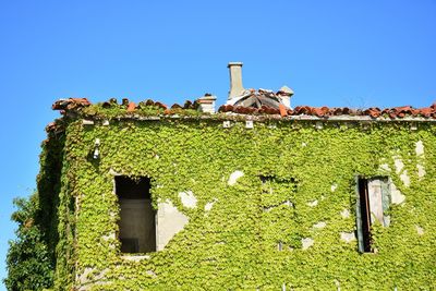 Low angle view of building against clear blue sky