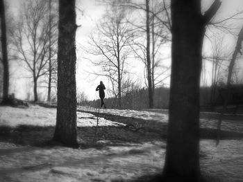 Woman walking on road