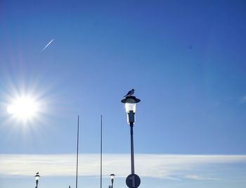 Low angle view of street light against sky